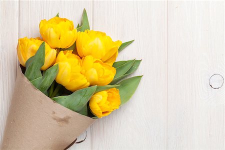 simsearch:400-08036453,k - Yellow tulips over wooden table background with copy space Stock Photo - Budget Royalty-Free & Subscription, Code: 400-08289467