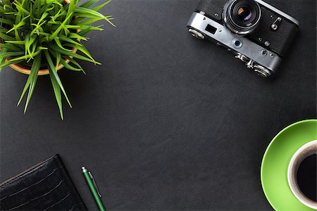 simsearch:400-08287336,k - Office leather desk table with camera, supplies, coffee cup and flower. Top view with copy space Stock Photo - Budget Royalty-Free & Subscription, Code: 400-08289499