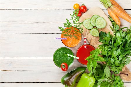 Fresh vegetable smoothie on wooden table. Tomato, cucumber, carrot. Top view with copy space Stock Photo - Budget Royalty-Free & Subscription, Code: 400-08289536