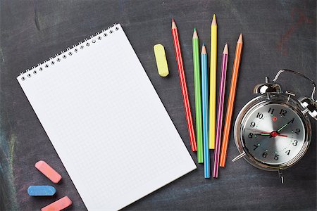 School and office supplies on blackboard background. Top view with copy space Stock Photo - Budget Royalty-Free & Subscription, Code: 400-08289552
