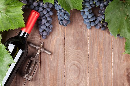 simsearch:400-08110621,k - Red grape, wine bottle and corkscrew on wooden table. Top view with copy space Stock Photo - Budget Royalty-Free & Subscription, Code: 400-08289624