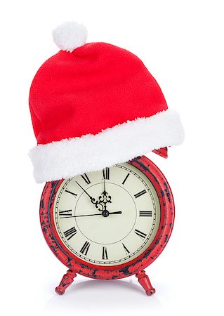 Christmas clock with santa hat. Isolated on white background Stock Photo - Budget Royalty-Free & Subscription, Code: 400-08289631
