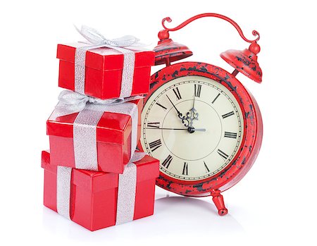 Christmas clock and three gift boxes. Isolated on white background Stock Photo - Budget Royalty-Free & Subscription, Code: 400-08289632