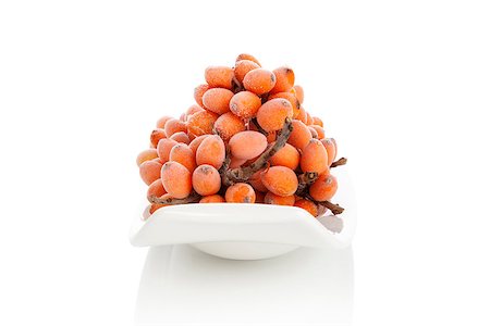 Frozen sea buckthorn berries isolated on white background. Healthy alternative medicine concept. Stock Photo - Budget Royalty-Free & Subscription, Code: 400-08283310