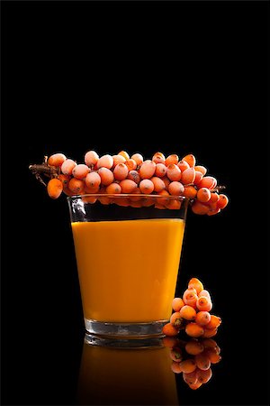Sea buckthorn juice and frozen berries isolated on black background. Alternative medicine. Detox. Stock Photo - Budget Royalty-Free & Subscription, Code: 400-08283312