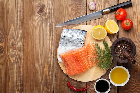 simsearch:400-08187570,k - Salmon, spices and condiments on wooden table. Top view with copy space Stockbilder - Microstock & Abonnement, Bildnummer: 400-08283588