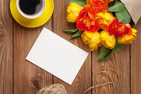 simsearch:400-08298802,k - Colorful tulips bouquet, blank greeting card and coffee cup on wooden table Photographie de stock - Aubaine LD & Abonnement, Code: 400-08283598