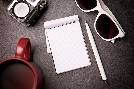 simsearch:400-08317316,k - Notepad, glasses, pen and cup on grey background with place for text Stock Photo - Budget Royalty-Free & Subscription, Code: 400-08283835