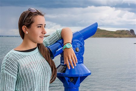 Closeup of beautiful teenager at the harbour looking away Stock Photo - Budget Royalty-Free & Subscription, Code: 400-08283945