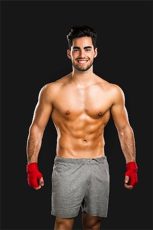 simsearch:400-08333281,k - Portrait of a young male Body Combat atlhlete, isolated over a gray background Stock Photo - Budget Royalty-Free & Subscription, Code: 400-08294366