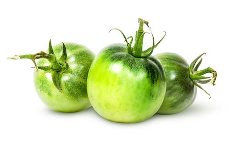 simsearch:400-06954534,k - In front three green tomatoes near isolated on white background Stock Photo - Budget Royalty-Free & Subscription, Code: 400-08294612