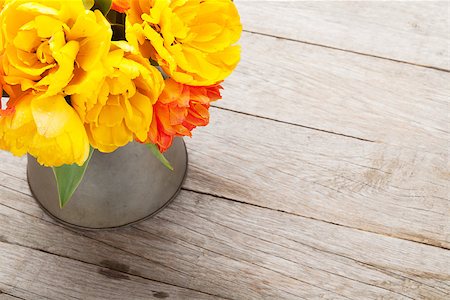 rustic wedding - Colorful tulips bouquet in watering can on wooden table. Top view with copy space Stock Photo - Budget Royalty-Free & Subscription, Code: 400-08294939