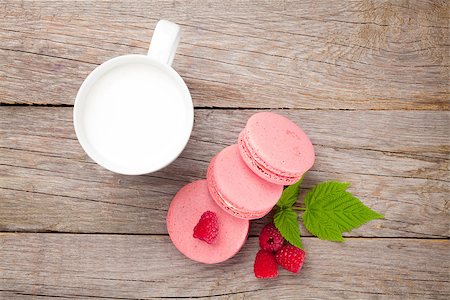 simsearch:400-06564979,k - Colorful raspberry macaron cookies and cup of milk on wooden table background Stock Photo - Budget Royalty-Free & Subscription, Code: 400-08294947