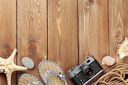 simsearch:400-08289506,k - Travel and vacation items on wooden table. Top view with copy space Photographie de stock - Aubaine LD & Abonnement, Code: 400-08294975