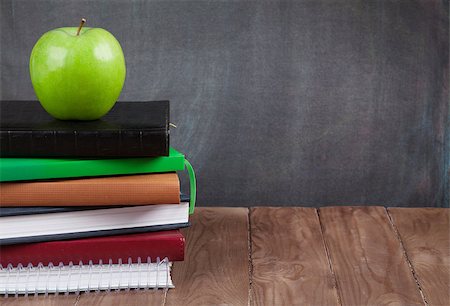 desk with school supplies - School and office supplies and apple on classroom table in front of blackboard. View with copy space Photographie de stock - Aubaine LD & Abonnement, Code: 400-08294984