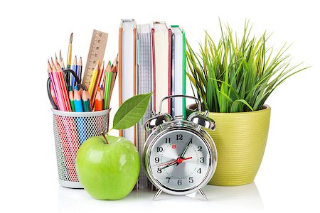 simsearch:400-08037305,k - School and office supplies. Notepads, colorful pencils, flower, alarm clock and apple. Isolated on white background Fotografie stock - Microstock e Abbonamento, Codice: 400-08294991