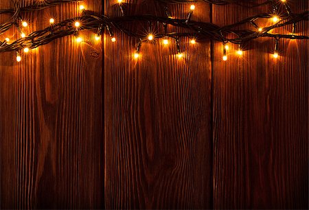 dark wood - Christmas lights on wooden background. View with copy space Stock Photo - Budget Royalty-Free & Subscription, Code: 400-08295025