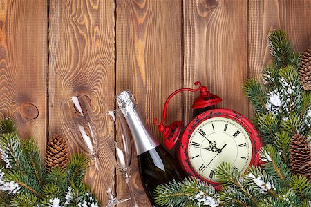Christmas wooden background with clock, snow fir tree and champagne Stock Photo - Budget Royalty-Free & Subscription, Code: 400-08295044