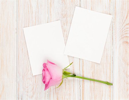 simsearch:400-08110734,k - Two blank photo frames and pink rose over wooden table Stock Photo - Budget Royalty-Free & Subscription, Code: 400-08295069