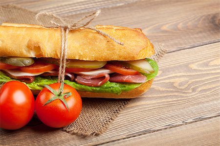 sandwich rustic table - Sandwich with salad, ham, cheese and tomatoes on wooden table Stock Photo - Budget Royalty-Free & Subscription, Code: 400-08295725