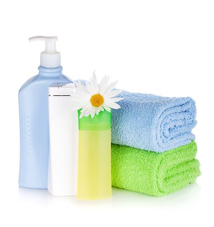 simsearch:400-04789848,k - Shampoo and gel bottles with towels and flower. Isolated on white background Stock Photo - Budget Royalty-Free & Subscription, Code: 400-08295754