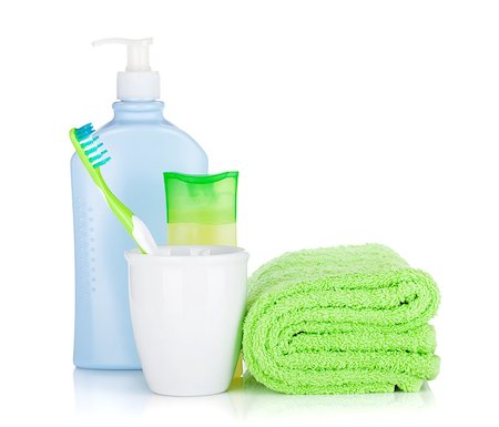 simsearch:400-04789848,k - Toothbrush, cosmetics bottles and towel. Isolated on white background Stock Photo - Budget Royalty-Free & Subscription, Code: 400-08295752