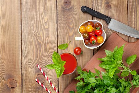 Fresh tomato juice smoothie with basil on wooden table. Top view with copy space Stock Photo - Budget Royalty-Free & Subscription, Code: 400-08295784