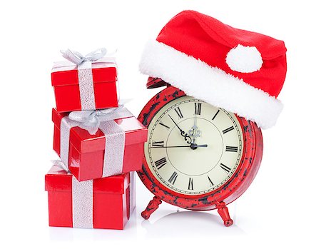 Christmas clock, gift boxes and santa hat. Isolated on white background Stock Photo - Budget Royalty-Free & Subscription, Code: 400-08295833