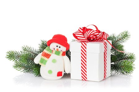 simsearch:400-07933751,k - Christmas gift box, snowman toy and fir tree branch. Isolated on white background Photographie de stock - Aubaine LD & Abonnement, Code: 400-08295853