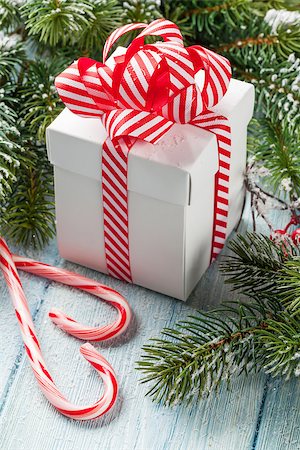 simsearch:400-04241664,k - Christmas gift box, candy cane and fir tree branch on wooden table Stock Photo - Budget Royalty-Free & Subscription, Code: 400-08295877