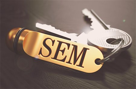 simsearch:400-07045079,k - Keys and Golden Keyring with the Word SEM - Search Engine Marketing - over Black Wooden Table with Blur Effect. Toned Image. Stock Photo - Budget Royalty-Free & Subscription, Code: 400-08296626