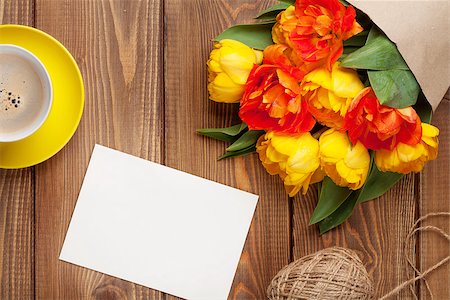 simsearch:400-08298802,k - Colorful tulips bouquet, blank greeting card and coffee cup on wooden table Photographie de stock - Aubaine LD & Abonnement, Code: 400-08296762