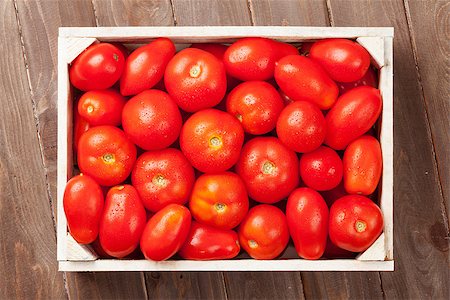 simsearch:400-07212038,k - Red tomatoes box on wooden table. Top view Stock Photo - Budget Royalty-Free & Subscription, Code: 400-08296789