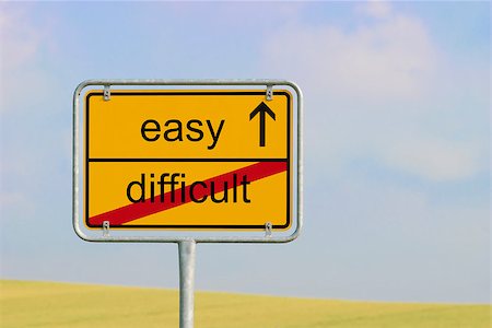 Yellow town sign with text "difficult easy" Stock Photo - Budget Royalty-Free & Subscription, Code: 400-08297630