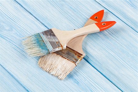 Paintbrush over blue wood. Top view Stock Photo - Budget Royalty-Free & Subscription, Code: 400-08298035
