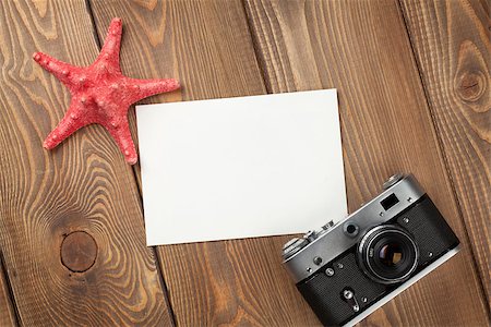simsearch:400-08289506,k - Travel and vacation photo frame, starfish and camera on wooden table Photographie de stock - Aubaine LD & Abonnement, Code: 400-08298051