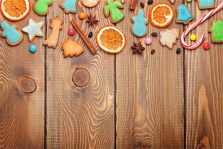 snowflake cookie - Christmas wooden background with candies, spices, gingerbread cookies and copy space Stock Photo - Budget Royalty-Free & Subscription, Code: 400-08298067