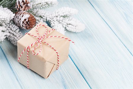 Christmas tree branch with snow and gift box Stock Photo - Budget Royalty-Free & Subscription, Code: 400-08298089