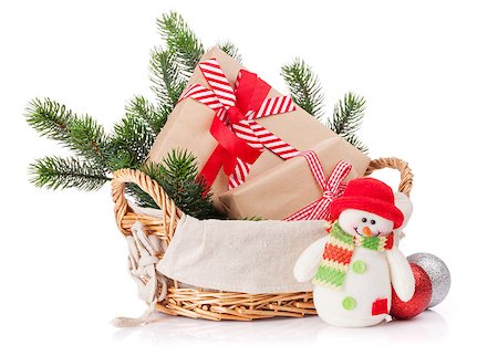 Christmas gift boxes, snowman toy, fir tree in basket. Isolated on white background Stock Photo - Budget Royalty-Free & Subscription, Code: 400-08298111