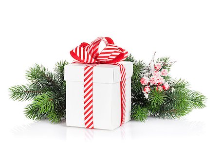 simsearch:400-07933751,k - Christmas gift box and fir tree branch. Isolated on white background Photographie de stock - Aubaine LD & Abonnement, Code: 400-08298128