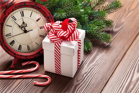 simsearch:400-04241664,k - Christmas alarm clock, gift box and fir tree branch on wooden table Stock Photo - Budget Royalty-Free & Subscription, Code: 400-08298146