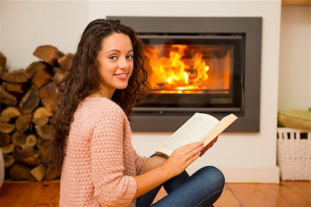 floor heat - Beautiful woman reading a book at the warmth of the fireplace Stock Photo - Budget Royalty-Free & Subscription, Code: 400-08298447