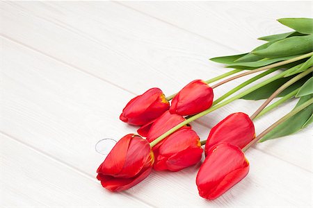 simsearch:400-08036453,k - Red tulips bouquet over white wooden table background with copy space Stock Photo - Budget Royalty-Free & Subscription, Code: 400-08298839