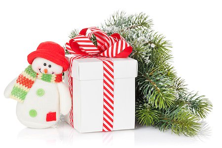 simsearch:400-07933751,k - Christmas gift box, snowman toy and fir tree branch. Isolated on white background Photographie de stock - Aubaine LD & Abonnement, Code: 400-08298907