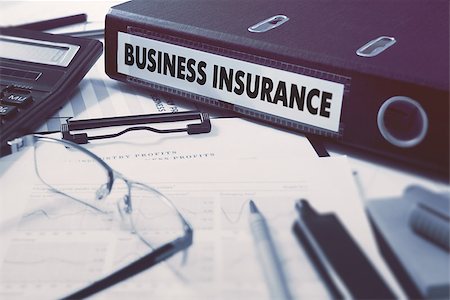 simsearch:400-08286893,k - Ring Binder with inscription Business Insurance on Background of Working Table with Office Supplies, Glasses, Reports. Toned Illustration. Business Concept on Blurred Background. Photographie de stock - Aubaine LD & Abonnement, Code: 400-08299026