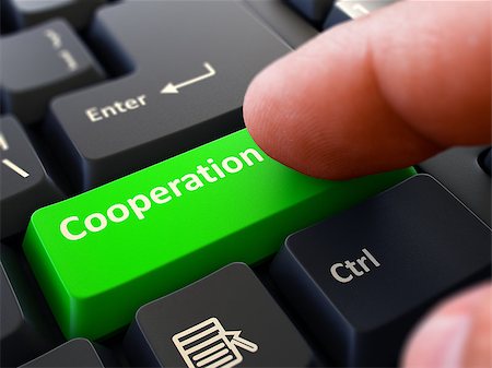 simsearch:400-08289045,k - Cooperation Button. Male Finger Clicks on Green Button on Black Keyboard. Closeup View. Blurred Background. Stock Photo - Budget Royalty-Free & Subscription, Code: 400-08299038