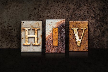 The word "HIV " written in rusty metal letterpress type on a dark textured grunge background. Photographie de stock - Aubaine LD & Abonnement, Code: 400-08299098