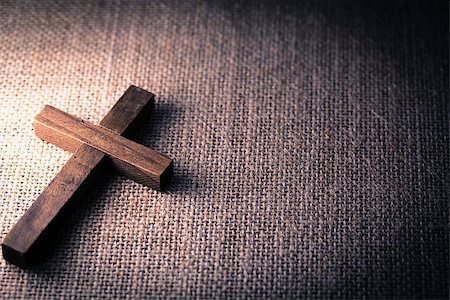 simsearch:400-07090264,k - An aerial view of a holy wooden Christian cross on a burlap background. Stock Photo - Budget Royalty-Free & Subscription, Code: 400-08299309