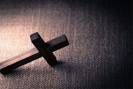 simsearch:400-07090264,k - An aerial view of a holy wooden Christian cross on a burlap background. Stock Photo - Budget Royalty-Free & Subscription, Code: 400-08299310