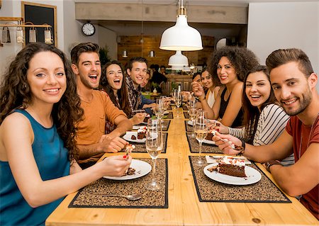 simsearch:400-08287050,k - Multi-Ethnic Group of happy friends lunching and tasting the dessert at the restaurant Stock Photo - Budget Royalty-Free & Subscription, Code: 400-08299454